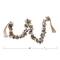 Hello Honey® 4ft. Oyster Shell Garland with Raffia Tassels
